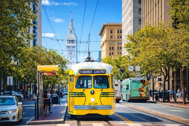 Things to do in San Francisco - Historic F Market streetcar in downtown San Francisco on a bright sunny afternoon with blue skies