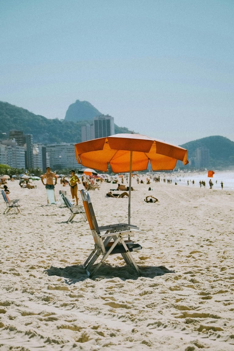 Empty beach chairs and umbrella on Copacabana Beach in Rio de Janeiro