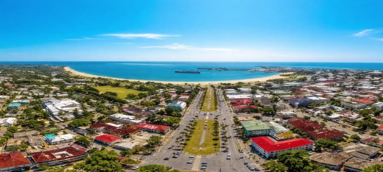 Aerial view of Tamatave (Toamasina) showing the coastal city, palm-lined boulevard, sandy beaches, and the busy port along Madagascar’s east coast.