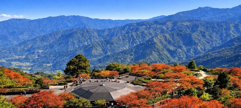 Autumn foliage viewpoint in Alishan with mountain ranges and observation platform overlooking forested valleys