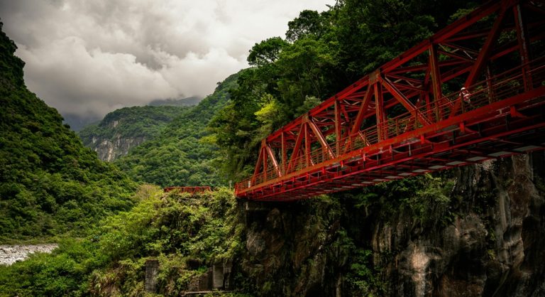 Buluowan Suspension Bridge in Taroko Gorge Taiwan surrounded by lush mountains and dramatic canyon scenery