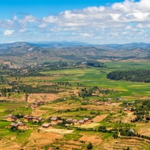 Central Highlands of Madagascar with rolling hills, rice fields, and rural villages near Antsirabe