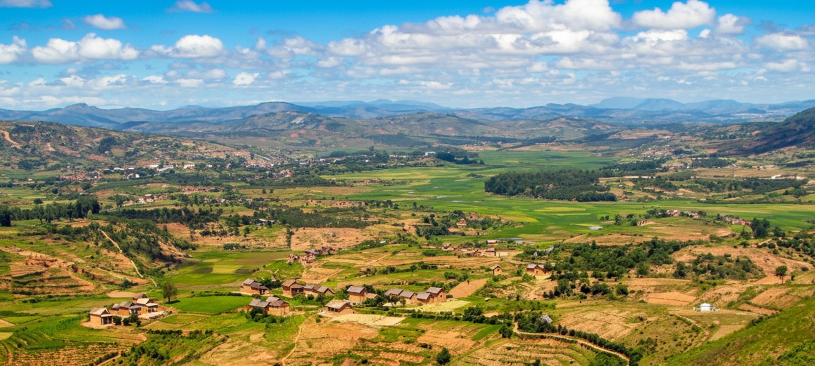 Central Highlands of Madagascar with rolling hills, rice fields, and rural villages near Antsirabe