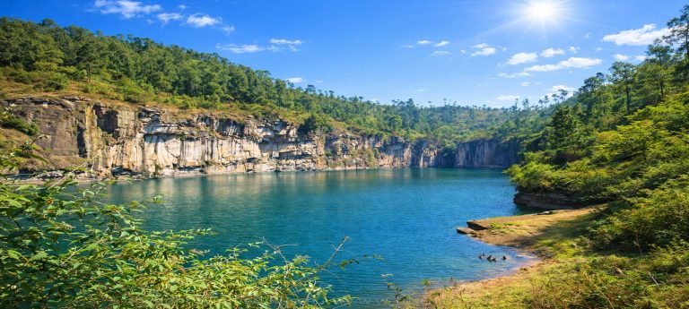 Lac Tritriva crater lake surrounded by forested cliffs near Antsirabe, Madagascar