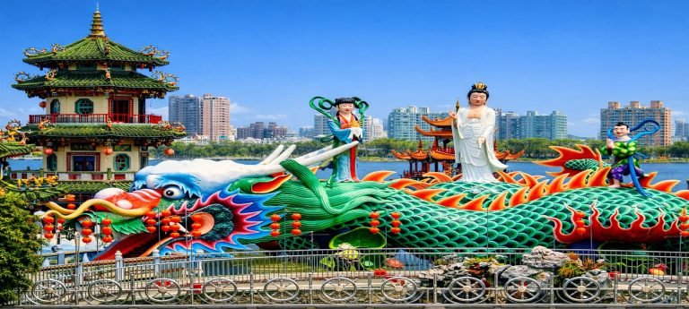 A traditional Chinese entrance gate or archway with the engraved text "大圣故里" (Hometown of the Great Sage), referring to the legendary figure Sun Wukong from Journey to the West.
