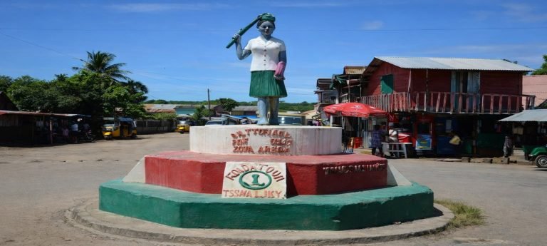 Statue in Sambava, Madagascar depicting a woman holding vanilla pods, symbolizing the region’s vanilla heritage