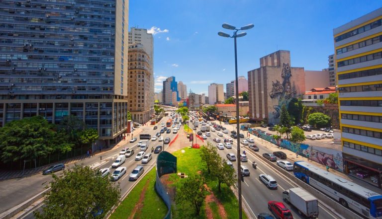 things to do in Sao Paulo city skyline busy avenue traffic downtown urban landscape