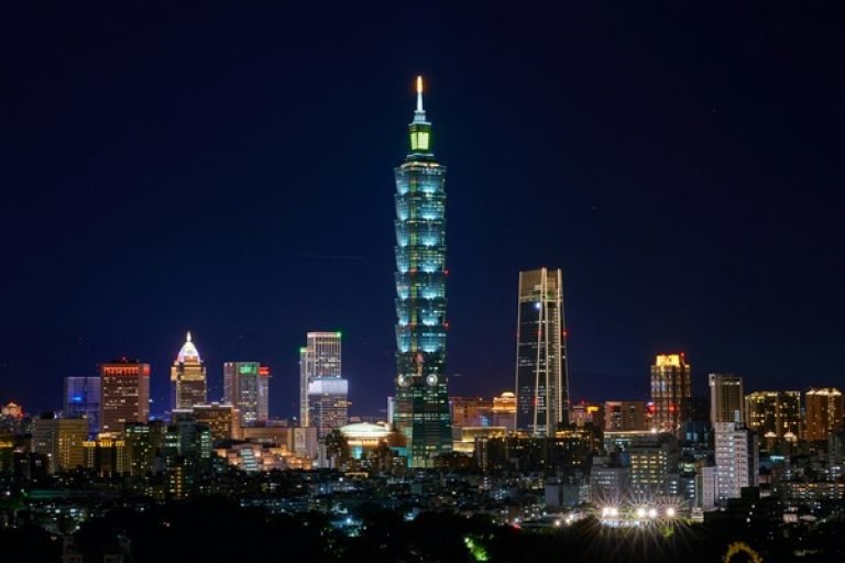 Things to do in Taipei: Taipei skyline at night featuring Taipei 101 lit up among city lights