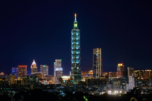 Things to do in Taipei: Taipei skyline at night featuring Taipei 101 lit up among city lights