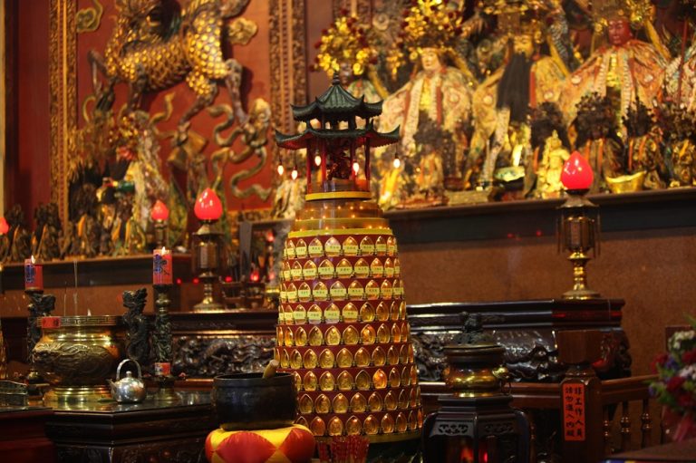 Ornate altar and glowing lanterns inside a traditional temple in Taichung, Taiwan
