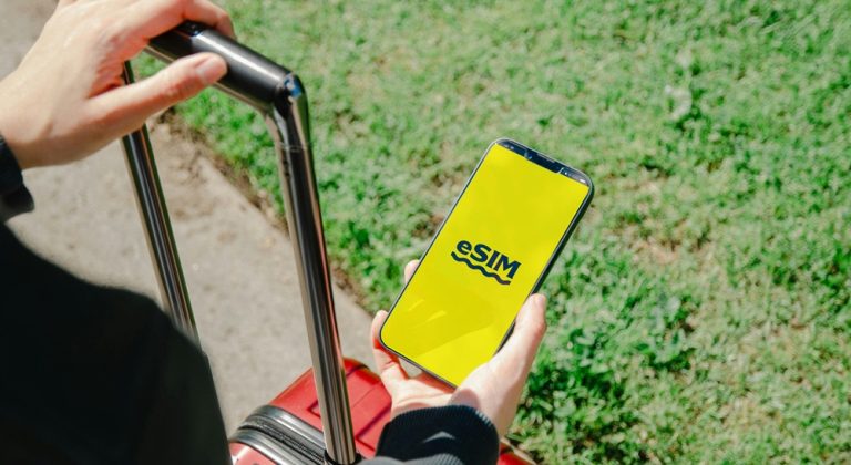 traveler using esim smartphone international travel mobile data connectivity