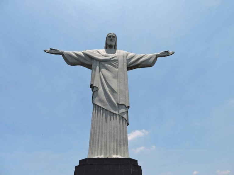 Close-up of Christ the Redeemer statue against a clear blue sky in Rio de Janeiro