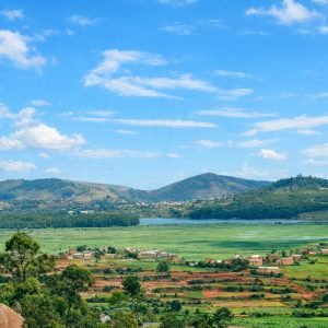 Madagascar Itinerary - Sunlit landscape of Madagascar’s Central Highlands with rolling hills, villages, and open countryside