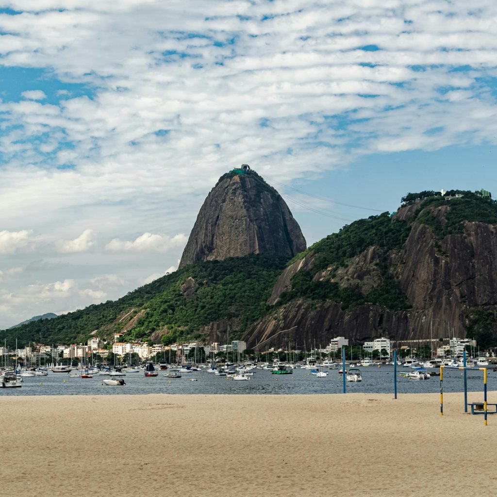 Sugarloaf Mountain Rio de Janeiro viewed from Praia Vermelha with boats in Guanabara Bay