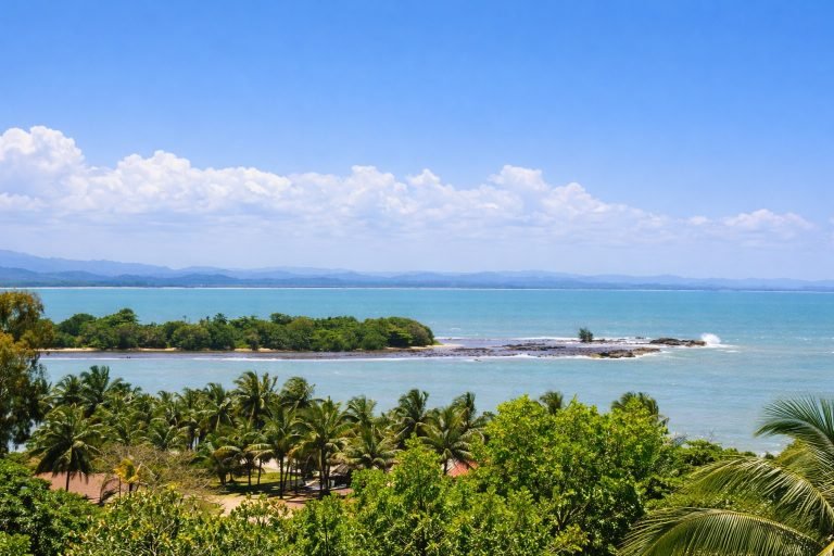Bright sunny coastline in Majunga Madagascar with blue skies tropical ocean and palm trees
