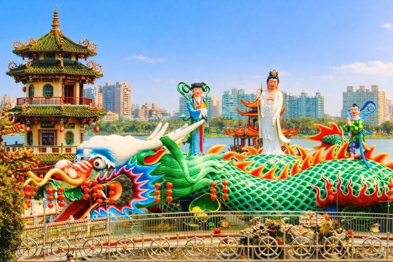 Taiwan itinerary - Dragon and Tiger Pagodas and colorful dragon statue at Lotus Pond in Kaohsiung, Taiwan on a sunny day