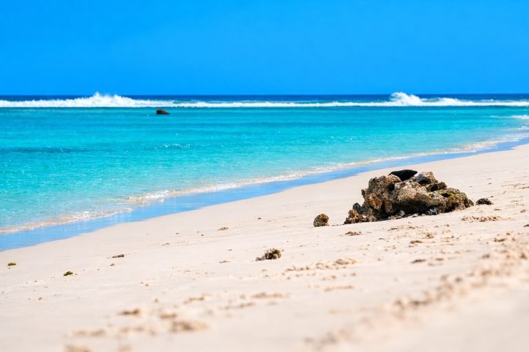 Foulpointe Beach Madagascar with white sand and turquoise lagoon behind coral reef