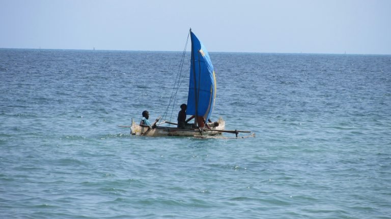Traditional sailing canoe near Ifaty Beach Madagascar on the turquoise Mozambique Channel Caption Description
