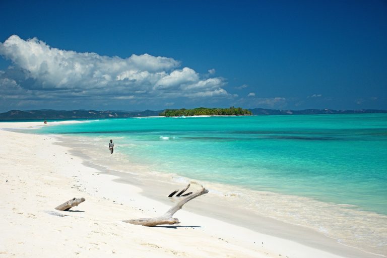 Madagascar packing list for beach travel with white sand beach and turquoise water in Nosy Be