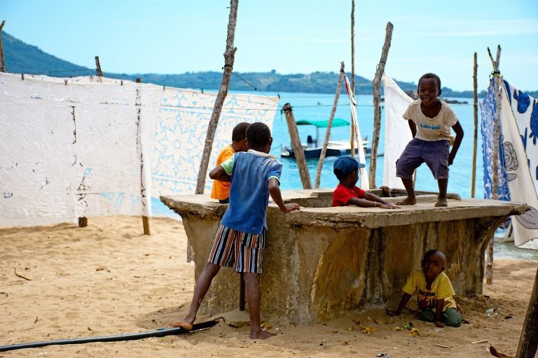 Madagascar packing list for coastal travel showing village life and beach scene in Madagascar Caption Description