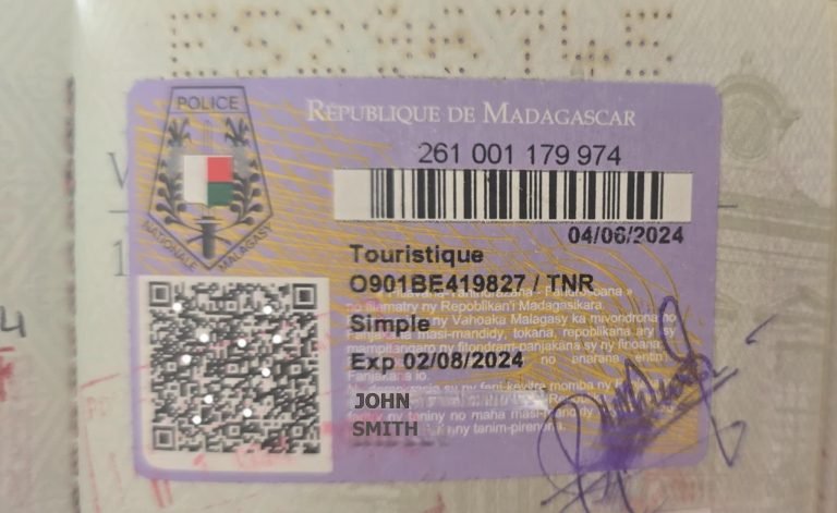 Madagascar visa guide - Example showing a tourist visa inside a passport with entry stamp and QR code