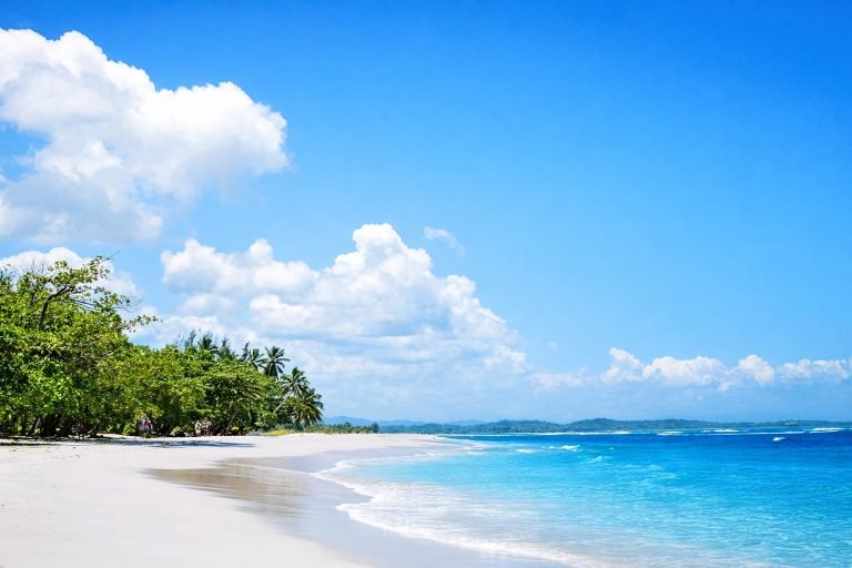 Mahambo Beach Madagascar with white sand and clear azure Indian Ocean water