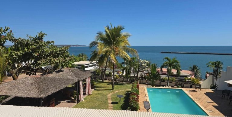 Ocean view from a hotel terrace in Mahajanga Madagascar with palm trees and swimming pool