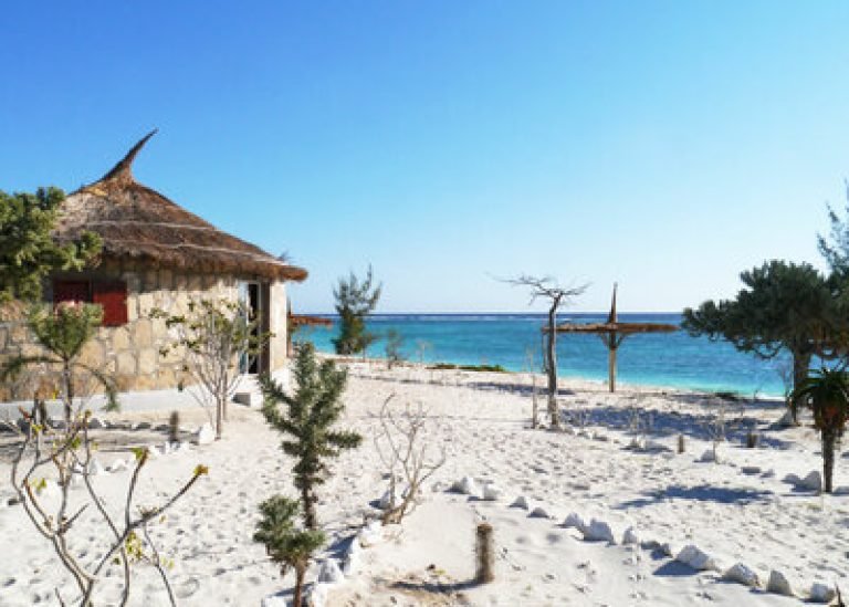 Southern Madagascar beaches with white sand, turquoise Indian Ocean water and coastal huts