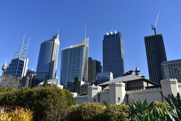 Sydney CBD skyline with modern skyscrapers viewed from Hyde Park on a clear sunny day