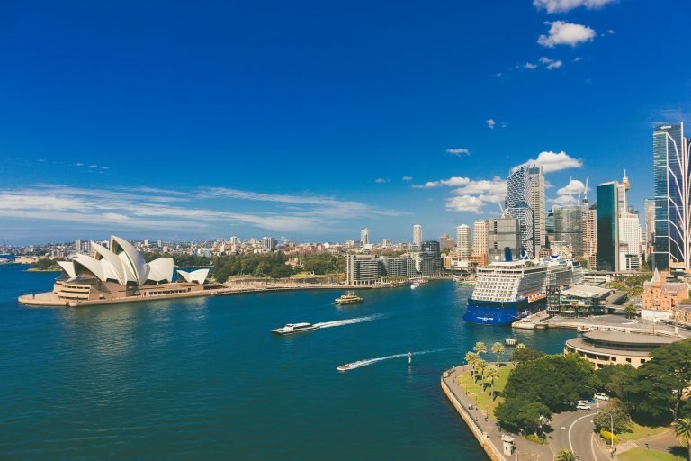 Sydney Harbour Cruises view with Opera House and Sydney skyline on a bright sunny day with blue skies