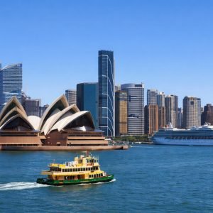 Sydney Tours Experiences - View of Sydney Opera House, harbour ferry, and city skyline on a clear day