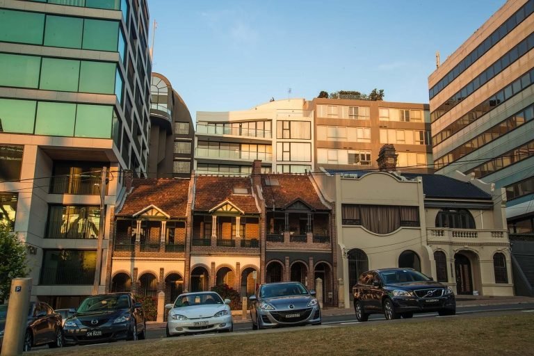 Sydney terrace houses with classic architecture alongside modern apartment buildings in the city