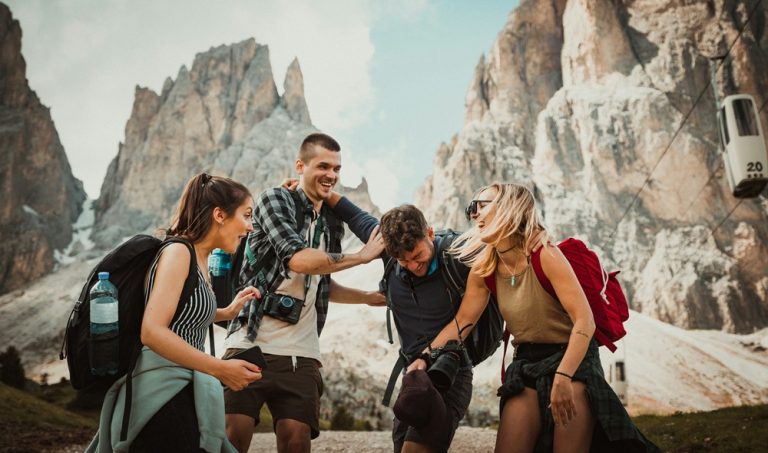 Group of travelers hiking illustrating credit-card-travel-insurance-vs-travel-insurance for international travel protection