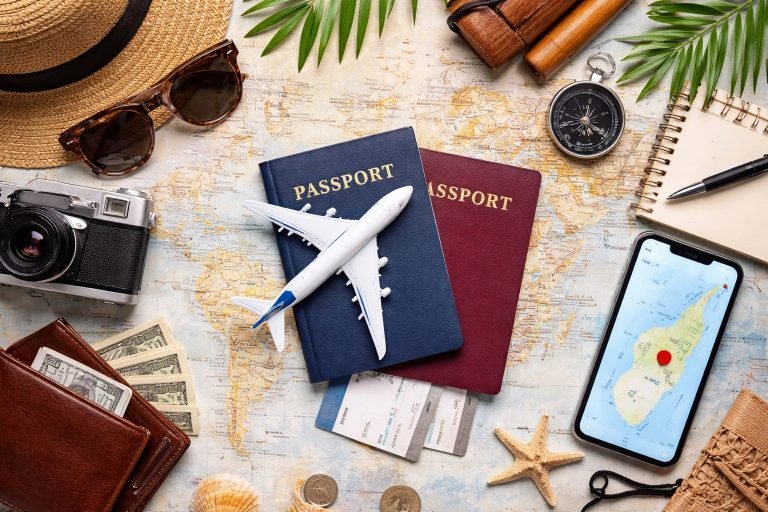 Madagascar eVisa application concept with passports travel accessories map and smartphone showing travel planning