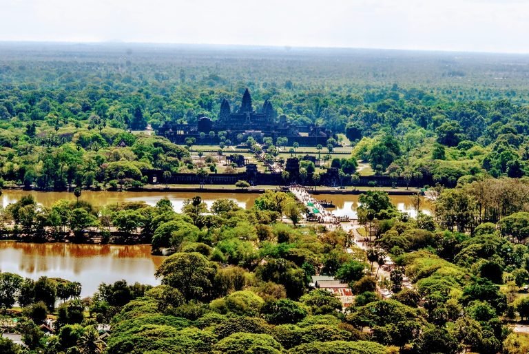 aerial view of Angkor Wat temple complex with moat and jungle landscape in Siem Reap Cambodia
