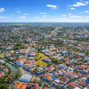 Things to do in Siem Reap - Seen from above with a clear blue sky, showcasing the city layout, river, and surrounding neighborhoods
