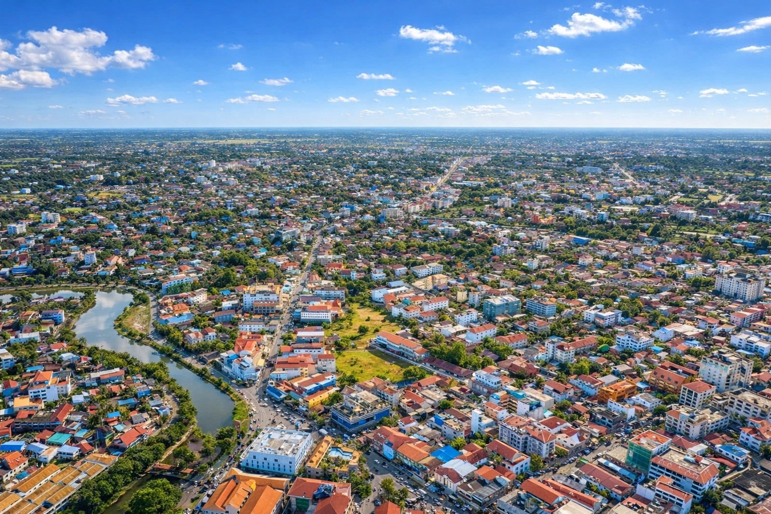 Things to do in Siem Reap - Seen from above with a clear blue sky, showcasing the city layout, river, and surrounding neighborhoods