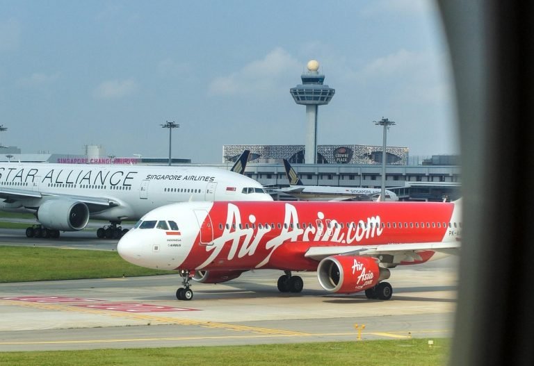 flights to Cambodia AirAsia plane at Singapore airport connection hub Asia