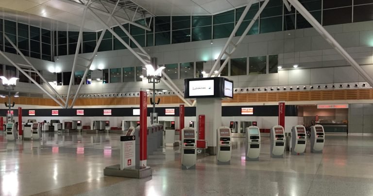 flights to Cambodia airport check-in counters self service kiosks departure hall