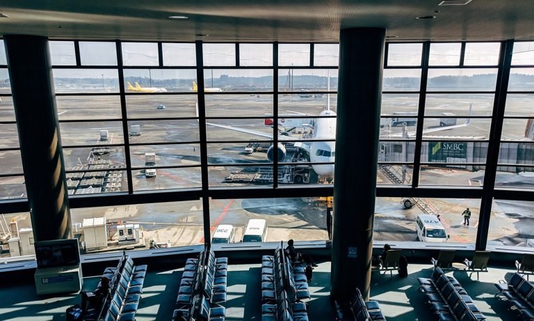 flights to Cambodia airport terminal waiting area departure gates and planes