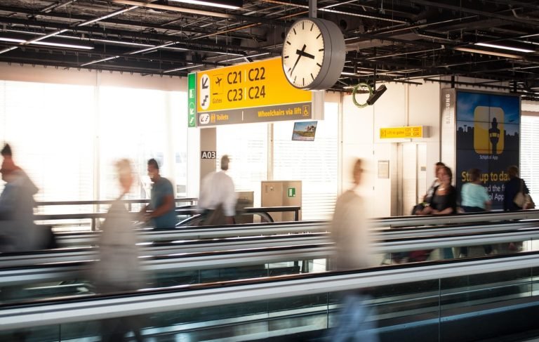 flights to Cambodia airport transit passengers moving between gates connection hub
