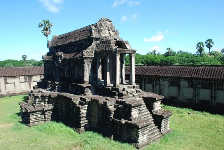 Cambodia itinerary exploring Angkor Wat temple architecture in Siem Reap with ancient stone structures and Khmer design