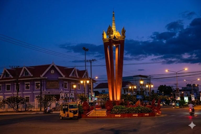 banlung town monument in northeast cambodia mondulkiri ratanakiri at night with street lights and local traffic 📝 Caption 📖 Description