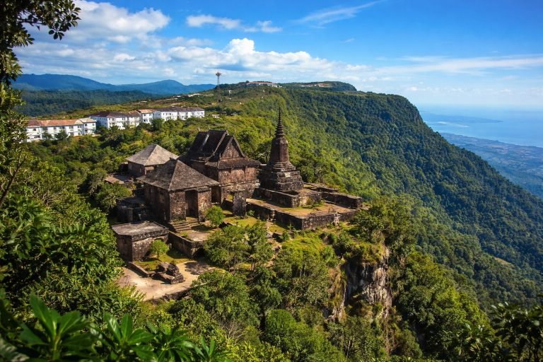 Things to do in Kampot - Bokor Mountain temple cliff view with jungle and coastline