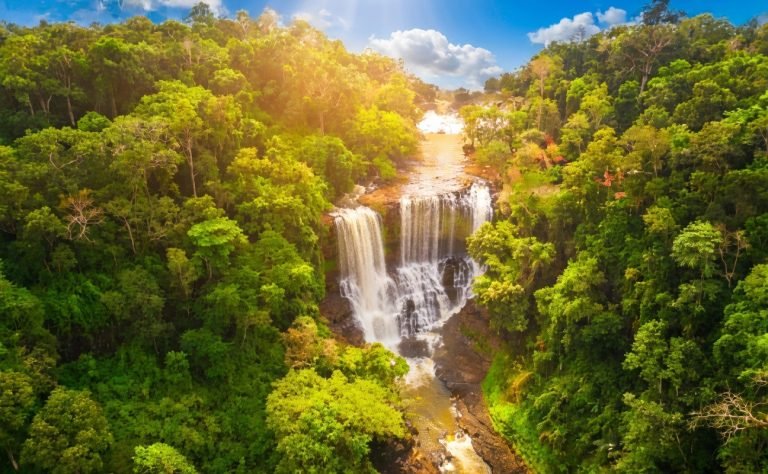 aerial view of bou sra waterfall cascading through dense jungle in mondulkiri cambodia