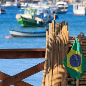 Brazil travel cost coastal harbor view with boats and Brazilian flag