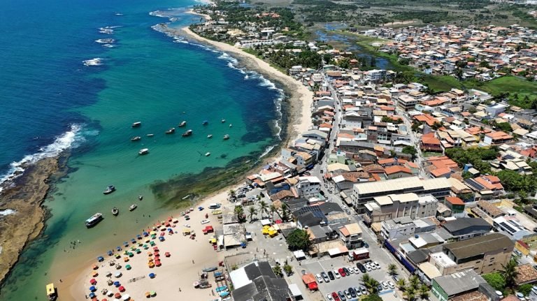 Brazil travel cost coastal town aerial beach boats shoreline view Caption: Description: