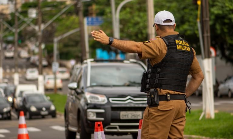 Is Brazil safe – police officer directing traffic at a checkpoint on a busy city street in Brazil