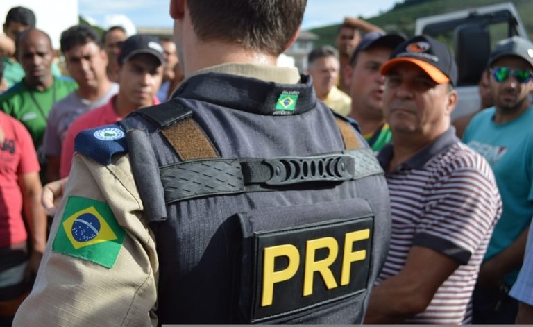 Is Brazil safe – police officer speaking to a group of people in a public setting in Brazil