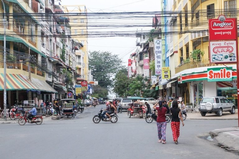 Is cambodia safe - busy Phnom Penh street with motorbikes traffic and pedestrians crossing